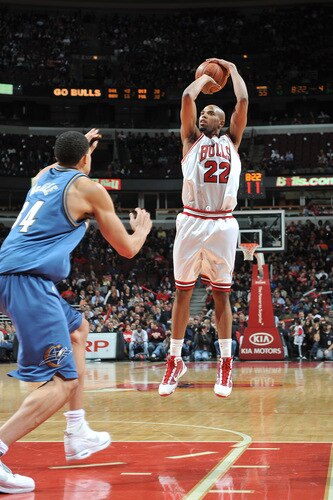 CHICAGO - OCTOBER 23: Taj Gibson #22 of the Chicago Bulls shoots the ball as JaVale McGee #34 of the Washington Wizards rushes in to block during the NBA preseason game on October 23, 2009 at the United Center in Chicago, Illinois. <br /><br /><span class="help">(Photo by Randy Belice/NBAE via Getty Images)</span>