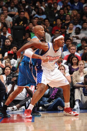 LOS ANGELES - OCTOBER 23: Craig Smith #5 of the Los Angeles Clippers boxes out against David West #30 of the New Orleans Hornets at Staples Center on October 23, 2009 in Los Angeles, California. <br /><br /><span class="help">(Photo by Noah Graham/NBAE via Getty Images)</span>