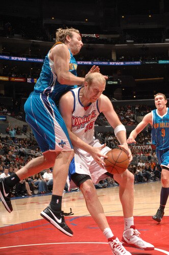 LOS ANGELES - OCTOBER 23:  Chris Kaman #35 of the Los Angeles Clippers makes a move in the post against Sean Marks #4 of the New Orleans Hornets at Staples Center on October 23, 2009 in Los Angeles, California. <br /><br /><span class="help">(Photo by Noah Graham/NBAE via Getty Images)</span>