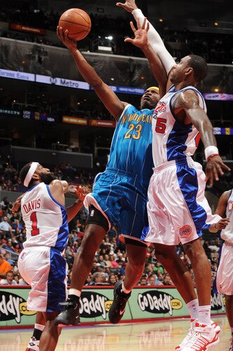 LOS ANGELES - OCTOBER 23:  Devin Brown #23 of the New Orleans Hornets goes up for a shot against Rasual Butler #45 of the Los Angeles Clippers at Staples Center on October 23, 2009 in Los Angeles, California. <br /><br /><span class="help">(Photo by Noah Graham/NBAE via Getty Images)</span>