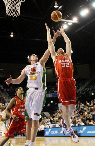 WOLLONGONG, AUSTRALIA - OCTOBER 24: Stephen Hoare of Townsville and Mat Campbell of the Hawks rebound during the round five NBL match between the Wollongong Hawks and the Townsville Crocodiles at Wollongong Entertainment Centre on October 24, 2009 in Wollongong, Australia.  <br /><br /><span class="help">(Photo by Mark Nolan/Getty Images)</span>