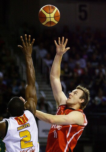 WOLLONGONG, AUSTRALIA - OCTOBER 24: Cameron Tragardh of the Hawks shoots for the basket during the round five NBL match between the Wollongong Hawks and the Townsville Crocodiles at Wollongong Entertainment Centre on October 24, 2009 in Wollongong, Australia.  <br /><br /><span class="help">(Photo by Mark Nolan/Getty Images)</span>