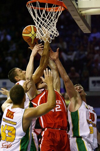 WOLLONGONG, AUSTRALIA - OCTOBER 24: Townsville and Hawks players try to rebound during the round five NBL match between the Wollongong Hawks and the Townsville Crocodiles at Wollongong Entertainment Centre on October 24, 2009 in Wollongong, Australia.  <br /><br /><span class="help">(Photo by Mark Nolan/Getty Images)</span>