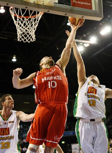 WOLLONGONG, AUSTRALIA - OCTOBER 24: Larry Davidson of the Hawks and Brad Williamson of Townsville try to rebound during the round five NBL match between the Wollongong Hawks and the Townsville Crocodiles at Wollongong Entertainment Centre on October 24, 2009 in Wollongong, Australia.  <br /><br /><span class="help">(Photo by Mark Nolan/Getty Images)</span>