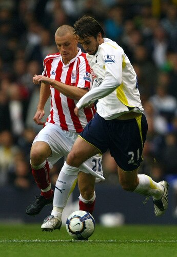 LONDON, ENGLAND - OCTOBER 24:  Vedran Corluka of Tottenham Hotspur is challenged by Andy Wilkinson of Stoke City during the Barclays Premier League match between Tottenham Hotspur and Stoke City at White Hart Lane on October 24, 2009 in London, England.  <br /><br /><span class="help">(Photo by Clive Rose/Getty Images)</span>
