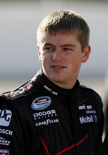 MEMPHIS, TN - OCTOBER 24:   Justin Allgaier, driver of the #12 Verizon Wireless Dodge stands on the grid during qualifying for the NASCAR Nationwide series Kroger 'On Track For Cure' 250 race at the Memphis Motorsports Park on October 24, 2009 in Memphis, Tennessee.  <br /><br /><span class="help">(Photo by John Sommers II/Getty Images)</span>