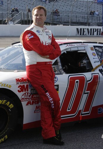 MEMPHIS, TN - OCTOBER 24:   Mike Wallace , driver of the #01 Nutone Chevrolet stands on the grid during qualifying for the NASCAR Nationwide series Kroger 'On Track For  Cure' 250 race at the Memphis Motorsports Park on October 24, 2009 in Memphis, Tennessee.  <br /><br /><span class="help">(Photo by John Sommers II/Getty Images)</span>
