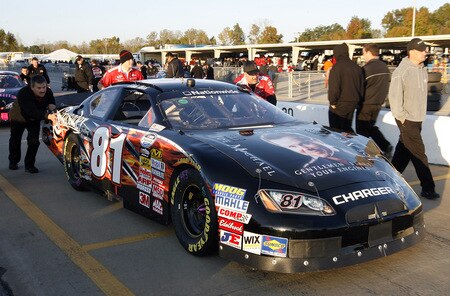 MEMPHIS, TN - OCTOBER 24:  The crew of Blake Koch pushes his  #81 Joe Michael/Crusader Staffing Dodge on to the grid during qualifying for the NASCAR Nationwide series Kroger 'On Track For Cure' 250 race at the Memphis Motorsports Park on October 24, 2009 in Memphis, Tennessee.  <br /><br /><span class="help">(Photo by John Sommers II/Getty Images)</span>