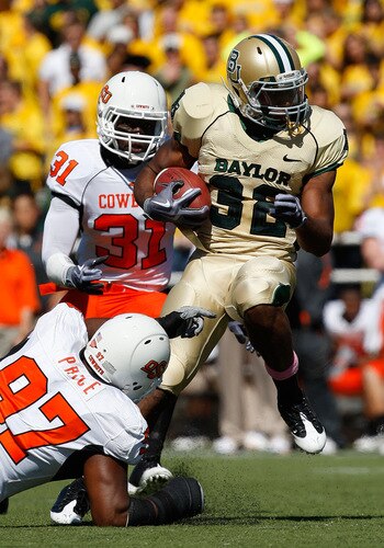 WACO, TX - OCTOBER 24:  Running back Jay Finley #32 of the Baylor Bears runs the ball past Jeremiah Price #97 of the Oklahoma State Cowboys at Floyd Casey Stadium on October 24, 2009 in Waco, Texas.  <br /><br /><span class="help">(Photo by Ronald Martinez/Getty Images)</span>