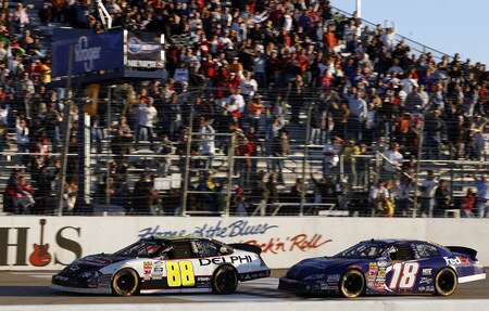 MEMPHIS, TN - OCTOBER 24:  Brad Keselowski, driver of the #88 Delphi Chevrolet crosses the finish line ahead of Casey Atwood, driver of the #18 FedEx Toyota to win the NASCAR Nationwide series Kroger 'On Track For Cure' 250 race at the Memphis Motorsports Park on October 24, 2009 in Memphis, Tennessee.  <br /><br /><span class="help">(Photo by John Sommers II/Getty Images)</span>