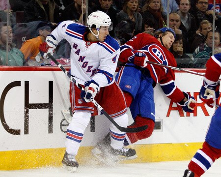 MONTREAL- OCTOBER 24: Michael Del Zotto #4 of the New York Rangers body checks Travis Moen #32 of the Montreal Canadiens during the NHL game on October 24, 2009 at the Bell Centre in Montreal, Quebec, Canada. <br /><br /><span class="help">(Photo by Richard Wolowicz/Getty Images)</span>