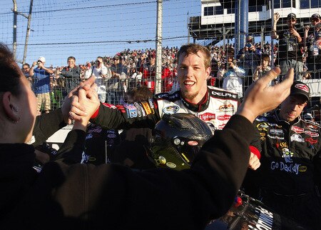 MEMPHIS, TN - OCTOBER 24:  Brad Keselowski, driver of the #88 Delphi Chevrolet celebrates with his team after winning the NASCAR Nationwide series Kroger 'On Track For Cure' 250 race at the Memphis Motorsports Park on October 24, 2009 in Memphis, Tennessee.  <br /><br /><span class="help">(Photo by John Sommers II/Getty Images)</span>