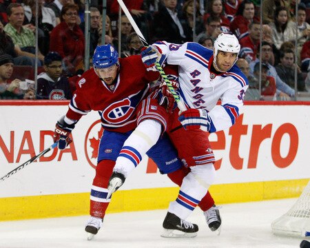 MONTREAL- OCTOBER 24: Michal Rozsival #33 of the New York Rangers body checks Tomas Plekanec #14 of the Montreal Canadiens during the NHL game on October 24, 2009 at the Bell Centre in Montreal, Quebec, Canada. <br /><br /><span class="help">(Photo by Richard Wolowicz/Getty Images)</span>