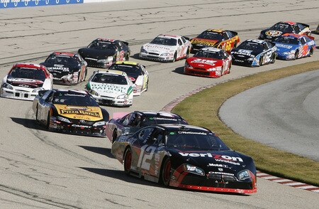 MEMPHIS, TN - OCTOBER 24:   Justin Allgaier, driver of the #12 Verizon Wireless Dodge leads the pack during the NASCAR Nationwide series Kroger 'On Track For  Cure' 250 race at the Memphis Motorsports Park on October 24, 2009 in Memphis, Tennessee.  <br /><br /><span class="help">(Photo by John Sommers II/Getty Images)</span>