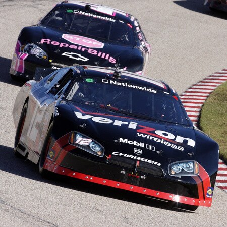 MEMPHIS, TN - OCTOBER 24:   Justin Allgaier, driver of the #12 Verizon Wireless Dodge leads the pack during the NASCAR Nationwide series Kroger 'On Track For  Cure' 250 race at the Memphis Motorsports Park on October 24, 2009 in Memphis, Tennessee.  <br /><br /><span class="help">(Photo by John Sommers II/Getty Images)</span>