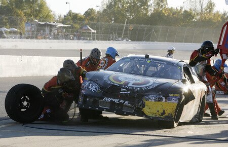 MEMPHIS, TN - OCTOBER 24:   Landon Cassill, drive of the #1 Miccosukee Indiana Gaming & Resort Chevrolet gets new tires during a pits stop in the NASCAR Nationwide series Kroger 'On Track For  Cure' 250 race at the Memphis Motorsports Park on October 24, 2009 in Memphis, Tennessee.  <br /><br /><span class="help">(Photo by John Sommers II/Getty Images)</span>