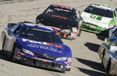 MEMPHIS, TN - OCTOBER 24:   Kyle Busch, driver of the # 18 FedEx Toyota leads the pack during the NASCAR Nationwide series Kroger 'On Track For  Cure' 250 race at the Memphis Motorsports Park on October 24, 2009 in Memphis, Tennessee.  <br /><br /><span class="help">(Photo by John Sommers II/Getty Images)</span>
