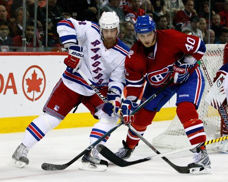 MONTREAL- OCTOBER 24: Christopher Higgins #21 of the New York Rangers and Maxim Lapierre #40 of the Montreal Canadiens battle for position during the NHL game on October 24, 2009 at the Bell Centre in Montreal, Quebec, Canada. <br /><br /><span class="help">(Photo by Richard Wolowicz/Getty Images)</span>