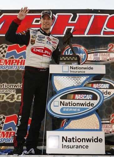 MEMPHIS, TN - OCTOBER 24:   Brad Keselowski , driver of the #88 Delphi Chevrolet poses with the winniner trophy after winning the NASCAR Nationwide series Kroger 'On Track For  Cure' 250 race at the Memphis Motorsports Park on October 24, 2009 in Memphis, Tennessee.  <br /><br /><span class="help">(Photo by John Sommers II/Getty Images)</span>
