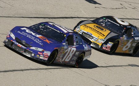 MEMPHIS, TN - OCTOBER 24:   Kyle Busch, driver of the # 18 FedEx Toyota leads the pack during the NASCAR Nationwide series Kroger 'On Track For  Cure' 250 race at the Memphis Motorsports Park on October 24, 2009 in Memphis, Tennessee.  <br /><br /><span class="help">(Photo by John Sommers II/Getty Images)</span>