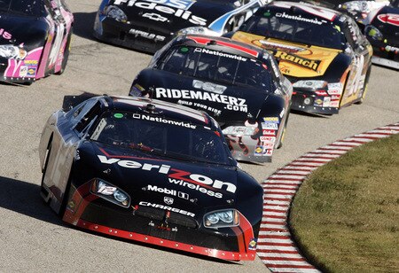 MEMPHIS, TN - OCTOBER 24:   Justin Allgaier, driver of the #12 Verizon Wireless Dodge leads the pack during the NASCAR Nationwide series Kroger 'On Track For  Cure' 250 race at the Memphis Motorsports Park on October 24, 2009 in Memphis, Tennessee.  <br /><br /><span class="help">(Photo by John Sommers II/Getty Images)</span>