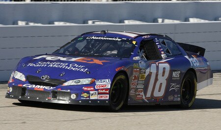 MEMPHIS, TN - OCTOBER 24:   Kyle Busch, driver of the # 18 FedEx Toyota leads the pack during the NASCAR Nationwide series Kroger 'On Track For  Cure' 250 race at the Memphis Motorsports Park on October 24, 2009 in Memphis, Tennessee.  <br /><br /><span class="help">(Photo by John Sommers II/Getty Images)</span>