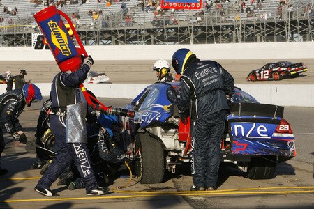 MEMPHIS, TN - OCTOBER 24:   Kevin Conway , driver of the #26 Extenze Chevrolet gets gas and tires during his pits stop in the NASCAR Nationwide series Kroger 'On Track For  Cure' 250 race at the Memphis Motorsports Park on October 24, 2009 in Memphis, Tennessee.  <br /><br /><span class="help">(Photo by John Sommers II/Getty Images)</span>