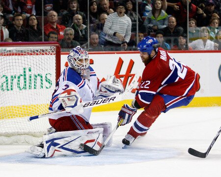 MONTREAL- OCTOBER 24: Henrik Lundqvist #30 of the New York Rangers stosp the puck on an attempt by Paul Mara #22 of the Montreal Canadiens during the NHL game on October 24, 2009 at the Bell Centre in Montreal, Quebec, Canada. <br /><br /><span class="help">(Photo by Richard Wolowicz/Getty Images)</span>