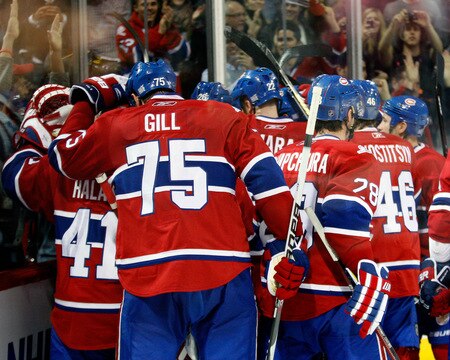 MONTREAL- OCTOBER 24: Members of the Montreal Canadiens celebrate the ovetime goal from team mate Mike Cammalleri #13 during the NHL game against the New York Rangers on October 24, 2009 at the Bell Centre in Montreal, Quebec, Canada. <br /><br /><span class="help">(Photo by Richard Wolowicz/Getty Images)</span>