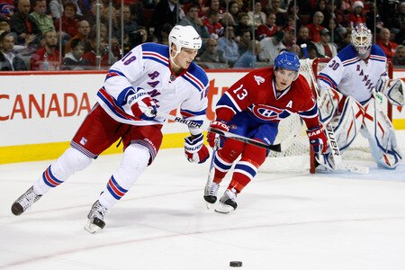 MONTREAL- OCTOBER 24: Marc Staal #18 of the New York Rangers skates with the puck while being chased by Mike Cammalleri #13 of the Montreal Canadiens during the NHL game on October 24, 2009 at the Bell Centre in Montreal, Quebec, Canada. <br /><br /><span class="help">(Photo by Richard Wolowicz/Getty Images)</span>
