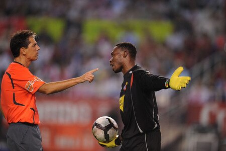 SEVILLE, SPAIN - OCTOBER 24: Referee Javier Turienzo (L) has a word with Carlos Kemeni  of RCD Espanyol during the La Liga match between Espanyol and Sevilla at Estadio Ramon Sanchez Pizjuan on October 24, 2009 in Seville, Spain. <br /><br /><span class="help">(Photo by Denis Doyle/Getty Images)</span>