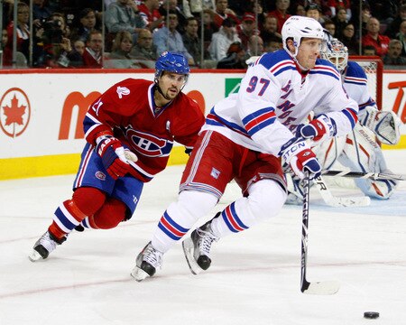 MONTREAL- OCTOBER 24: Brian Gionta #21 of the Montreal Canadiens chaes Matt Gilroy #97 of the New York Rangers during the NHL game on October 24, 2009 at the Bell Centre in Montreal, Quebec, Canada. <br /><br /><span class="help">(Photo by Richard Wolowicz/Getty Images)</span>