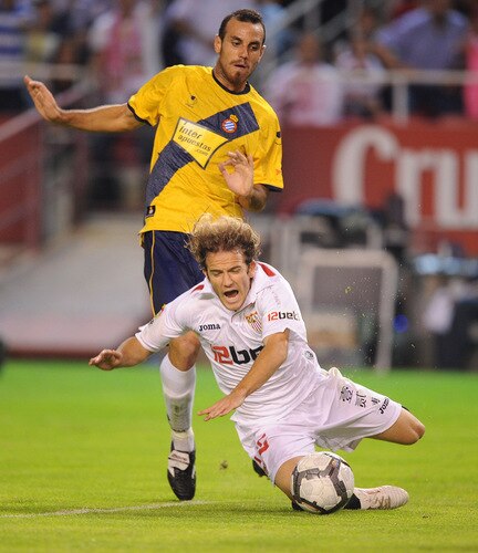 SEVILLE, SPAIN - OCTOBER 24: Diego Capel of Sevilla is tackled by Moises Hurtado of RCD Espanyol defense during the La Liga match between Espanyol and Sevilla at Estadio Ramon Sanchez Pizjuan on October 24, 2009 in Seville, Spain.  <br /><br /><span class="help">(Photo by Denis Doyle/Getty Images)</span>