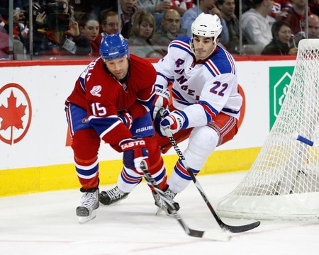 MONTREAL- OCTOBER 24: Glen Metropolit #15 of the Montreal Canadiens passes the puck while being dfended by Brian Boyle #22 of the New York Rangers during the NHL game on October 24, 2009 at the Bell Centre in Montreal, Quebec, Canada. <br /><br /><span class="help">(Photo by Richard Wolowicz/Getty Images)</span>