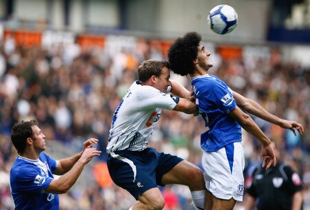 BOLTON, ENGLAND - OCTOBER 25:  Kevin Davies of Bolton Wanderers tackles Marouane Fellaini of Everton during the Barclays Premier League match between Bolton Wanderers and Everton at Reebok Stadium on October 25, 2009 in Bolton, England.  <br /><br /><span class="help">(Photo by Jeff J Mitchell/Getty Images)</span>