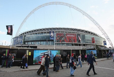 LONDON, ENGLAND - OCTOBER 25:  Fans make their way to the stadium prior to the NFL International Series match between New England Patriots and Tampa Bay Buccaneers at Wembley Stadium on October 25, 2009 in London, England. This is the third occasion where a regular season NFL match has been played in London.  <br /><br /><span class="help">(Photo by Elsa/Getty Images)</span>