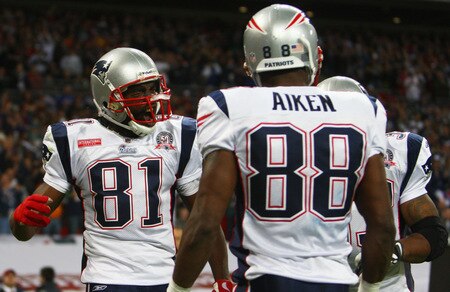 LONDON, ENGLAND - OCTOBER 25:  Sam Aiken (#88) of the New England Patriots celebrates scoring the third touchdown with his teammate Randy Moss (#81) of the New England Patriots during the NFL International Series match between New England Patriots and Tampa Bay Buccaneers at Wembley Stadium on October 25, 2009 in London, England. This is the third occasion where a regular season NFL match has been played in London.  <br /><br /><span class="help">(Photo by Julian Finney/Getty Images)</span>