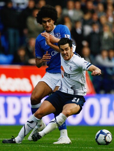 BOLTON, ENGLAND - OCTOBER 25:  Tamir Cohen of Bolton Wanderers tackles Marouane Fellaini of Everton during the Barclays Premier League match between Bolton Wanderers and Everton at Reebok Stadium on October 25, 2009 in Bolton, England.  <br /><br /><span class="help">(Photo by Jeff J Mitchell/Getty Images)</span>