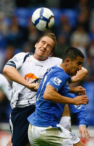 BOLTON, ENGLAND - OCTOBER 25:  Kevin Davies of Bolton Wanderers tackles Tim Cahill of Everton during the Barclays Premier League match between Bolton Wanderers and Everton at Reebok Stadium on October 25, 2009 in Bolton, England.  <br /><br /><span class="help">(Photo by Jeff J Mitchell/Getty Images)</span>