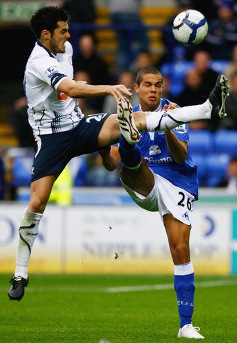 BOLTON, ENGLAND - OCTOBER 25:  Tamir Cohen of Bolton Wanderers tackles Jack Rodwell of Everton during the Barclays Premier League match between Bolton Wanderers and Everton at Reebok Stadium on October 25, 2009 in Bolton, England.  <br /><br /><span class="help">(Photo by Jeff J Mitchell/Getty Images)</span>