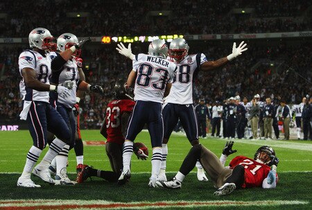 LONDON, ENGLAND - OCTOBER 25:  Wes Welker (#83) of the New England Patriots is congratulated by his teamates after scoring the second touchdown during the NFL International Series match between New England Patriots and Tampa Bay Buccaneers at Wembley Stadium on October 25, 2009 in London, England. This is the third occasion where a regular season NFL match has been played in London.  <br /><br /><span class="help">(Photo by Tom Shaw/Getty Images)</span>