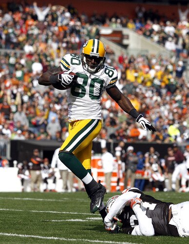 CLEVELAND, OH - OCTOBER 25:  Donald Driver #80 of the Green Bay Packers scores a touchdown in front of Brodney Pool #21 of the Cleveland Browns at Cleveland Browns Stadium on October 25, 2009 in Cleveland, Ohio.  <br /><br /><span class="help">(Photo by Matt Sullivan/Getty Images)</span>