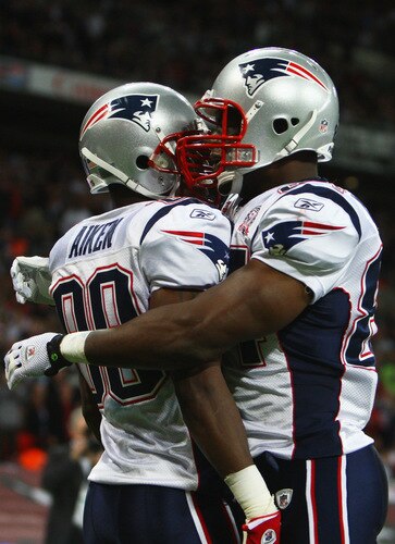 LONDON, ENGLAND - OCTOBER 25:  Sam Aiken (#88) of the New England Patriots celebrates scoring the third touchdown with his teammate Randy Moss (#81) of the New England Patriots during the NFL International Series match between New England Patriots and Tampa Bay Buccaneers at Wembley Stadium on October 25, 2009 in London, England. This is the third occasion where a regular season NFL match has been played in London.  <br /><br /><span class="help">(Photo by Julian Finney/Getty Images)</span>