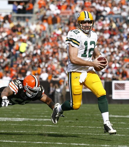 CLEVELAND, OH - OCTOBER 25:  Aaron Rodgers #12 of the Green Bay Packers runs by Kaluka Maiava #56 of the Cleveland Browns at Cleveland Browns Stadium on October 25, 2009 in Cleveland, Ohio.  <br /><br /><span class="help">(Photo by Matt Sullivan/Getty Images)</span>
