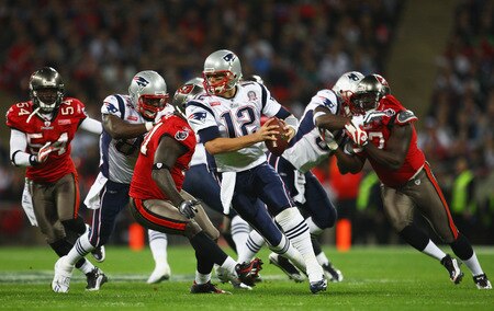 LONDON, ENGLAND - OCTOBER 25:  Tom Brady (#12) of the New England Patriots makes a playduring the NFL International Series match between New England Patriots and Tampa Bay Buccaneers at Wembley Stadium on October 25, 2009 in London, England. This is the third occasion where a regular season NFL match has been played in London.  <br /><br /><span class="help">(Photo by Julian Finney/Getty Images)</span>