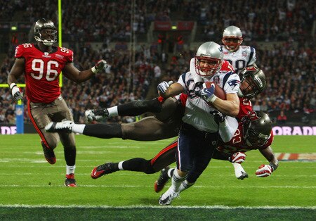 LONDON, ENGLAND - OCTOBER 25:  Wes Welker (#83) of the New England Patriots goes over for the second touchdown during the NFL International Series match between New England Patriots and Tampa Bay Buccaneers at Wembley Stadium on October 25, 2009 in London, England. This is the third occasion where a regular season NFL match has been played in London.  <br /><br /><span class="help">(Photo by Tom Shaw/Getty Images)</span>