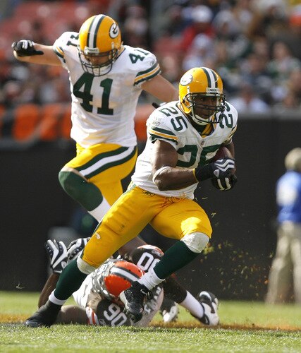 CLEVELAND, OH - OCTOBER 25:  Ryan Grant #25 of the Green Bay Packers runs by Kenyon Coleman #90 of the Cleveland Browns at Cleveland Browns Stadium on October 25, 2009 in Cleveland, Ohio.  <br /><br /><span class="help">(Photo by Matt Sullivan/Getty Images)</span>