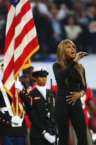 LONDON, ENGLAND - OCTOBER 25:  Toni Braxton performs the national anthem of the USA prior to the NFL International Series match between New England Patriots and Tampa Bay Buccaneers at Wembley Stadium on October 25, 2009 in London, England. This is the third occasion where a regular season NFL match has been played in London.  <br /><br /><span class="help">(Photo by Tom Shaw/Getty Images)</span>