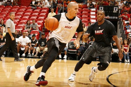 MIAMI - OCTOBER 25: Carlos Arroyo #8 and Mario Chalmers #6 of the Miami Heat participate in the 2009 Miami Heat Open Practice on October 25, 2009 at the America Airlines Arena in Miami, Florida. <br /><br /><span class="help">(Photo by Issac Baldizon/NBAE via Getty Images)</span>