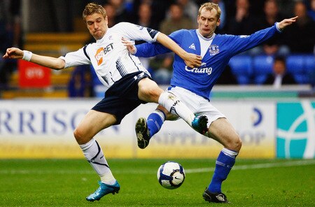 BOLTON, ENGLAND - OCTOBER 25:  Ivan Klasnic of Bolton Wanderers tackles Tony Hibbert of Everton during the Barclays Premier League match between Bolton Wanderers and Everton at Reebok Stadium on October 25, 2009 in Bolton, England.  <br /><br /><span class="help">(Photo by Jeff J Mitchell/Getty Images)</span>